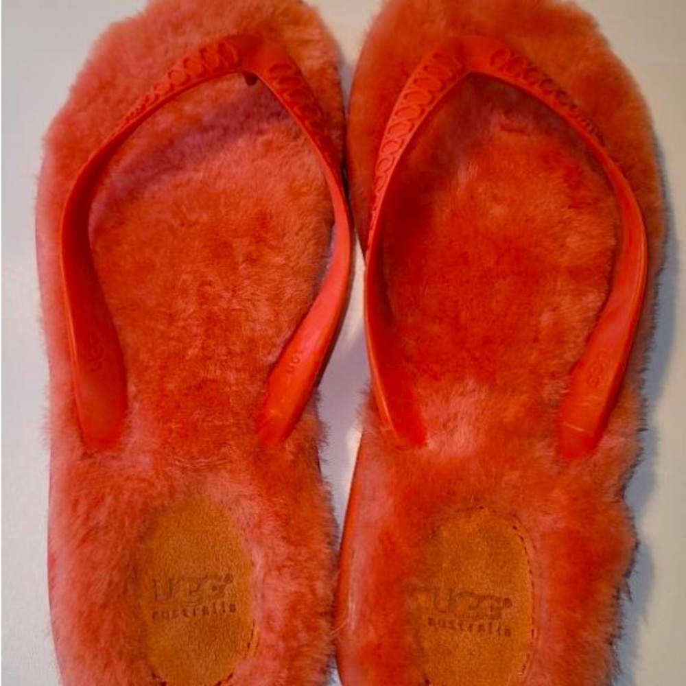 Fun tangerine colored Ugg fluff flip flops